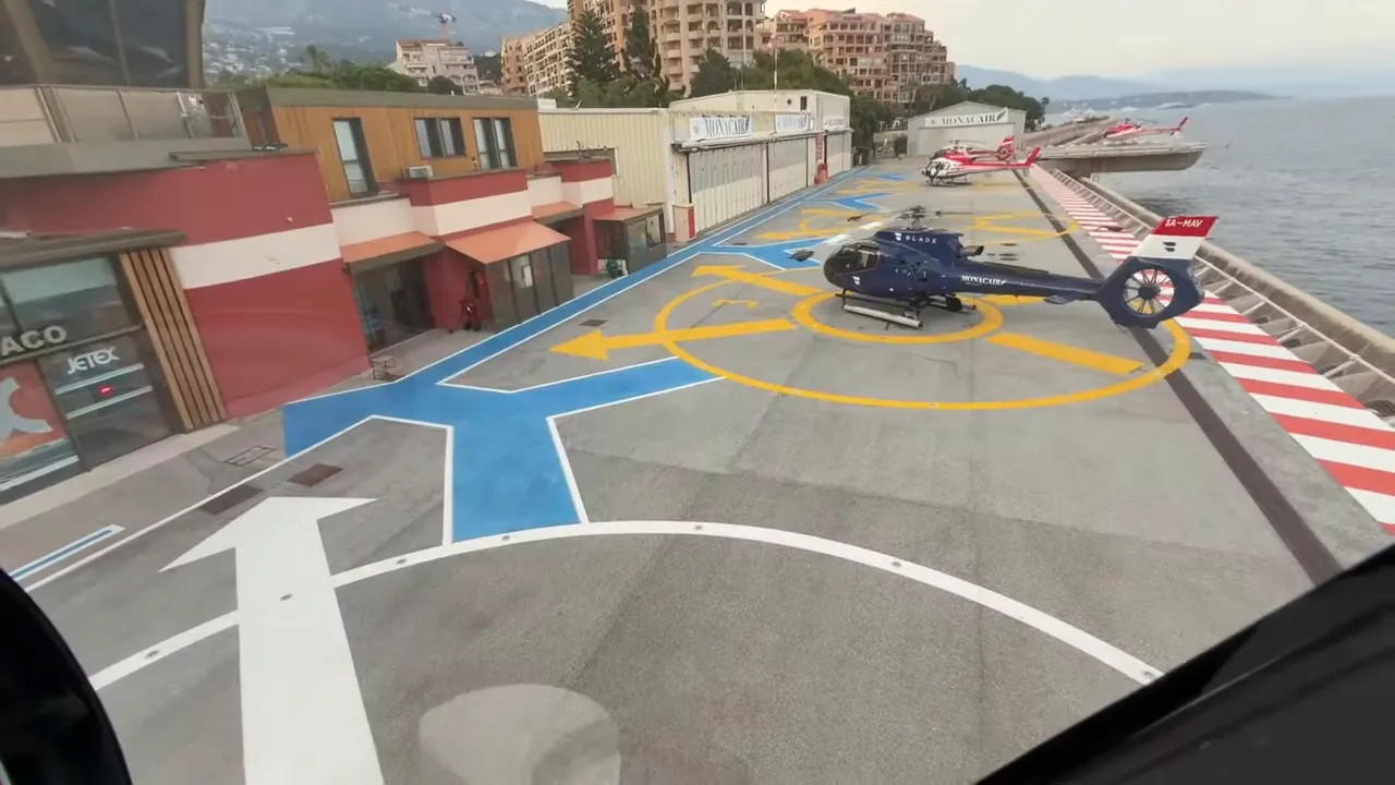 Helicopter approaching the Monaco helipad near the waterfront