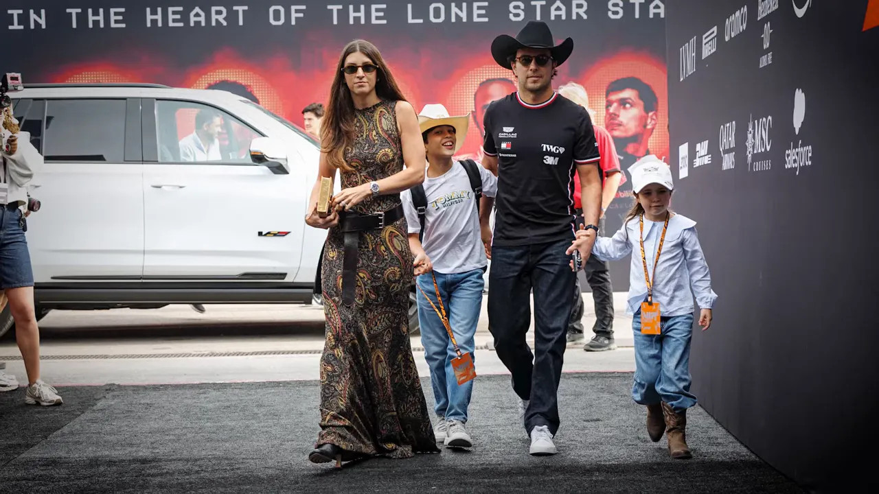 Sergio Pérez wearing a cowboy hat as he arrives with Carola and their 2 children