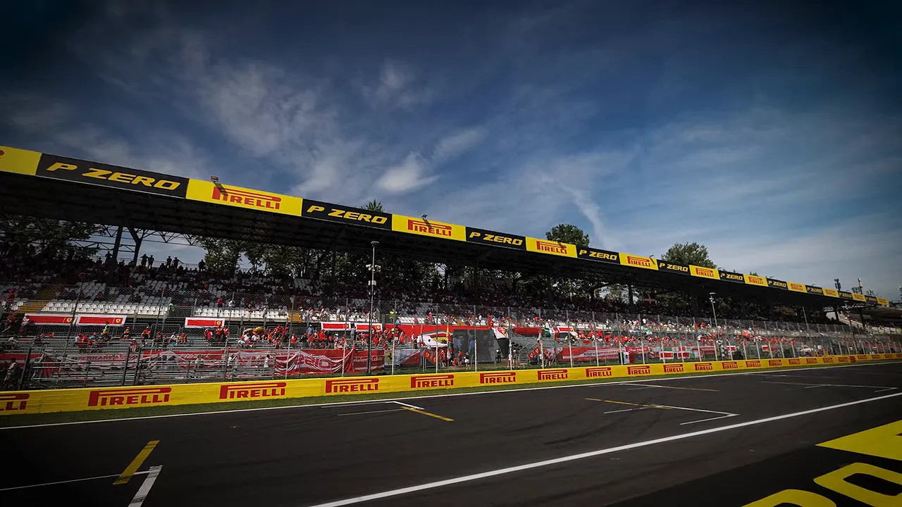 Main grandstand and pit straight at Monza under a cloudy sky