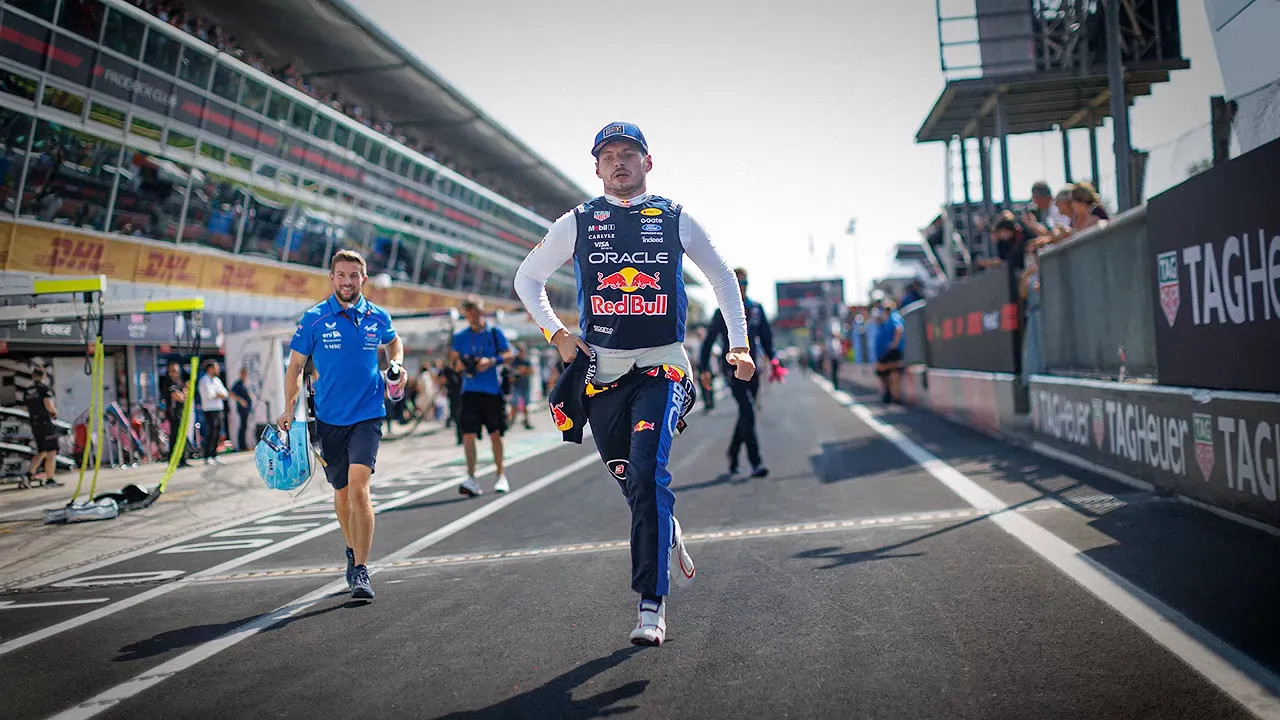 Max Verstappen walks quickly along the Monza pit lane