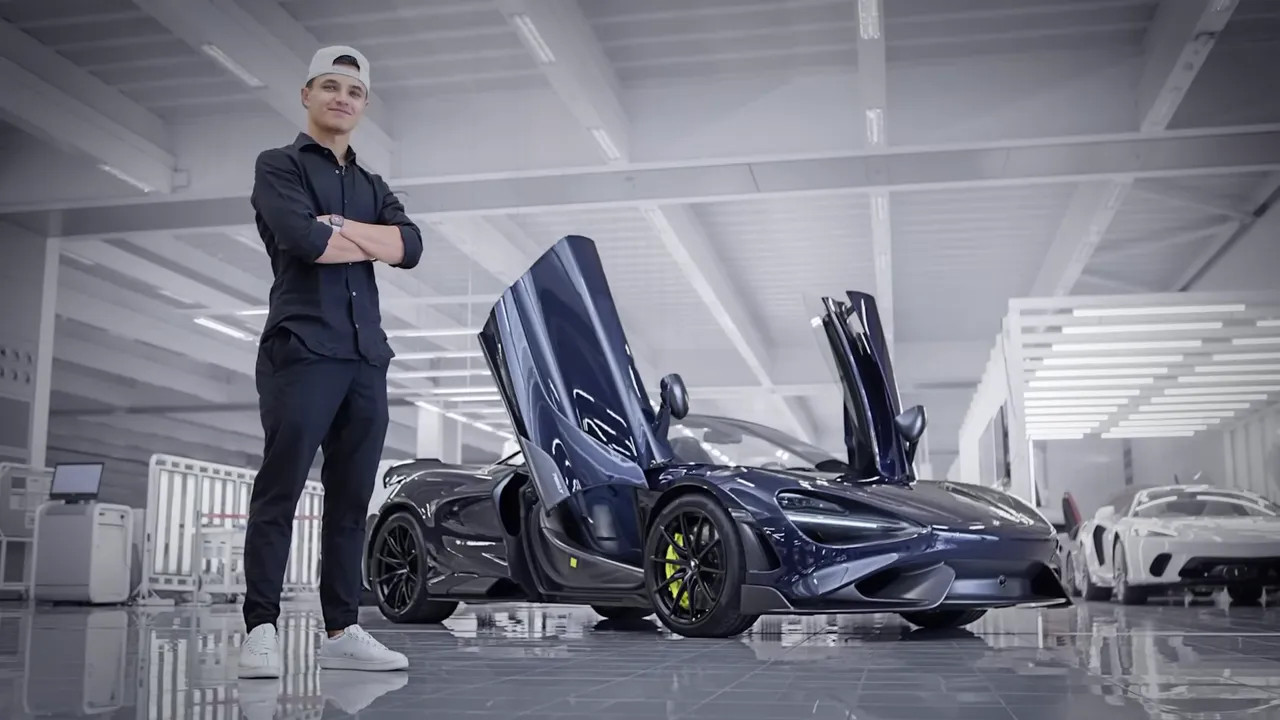 McLaren 765LT carbon blue supercar with the butterfly doors raised in a showroom
