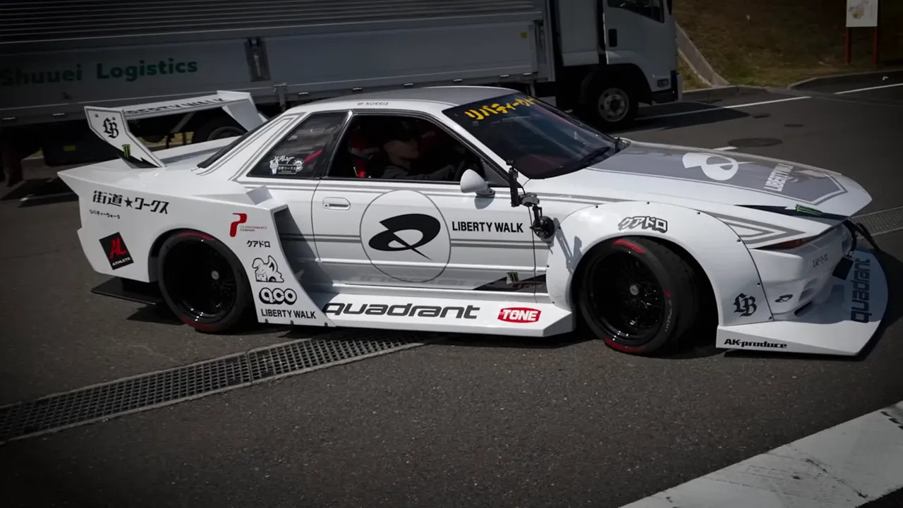Side view of Liberty Walk Nissan Skyline GT-R R32 with Liberty Walk graphics
