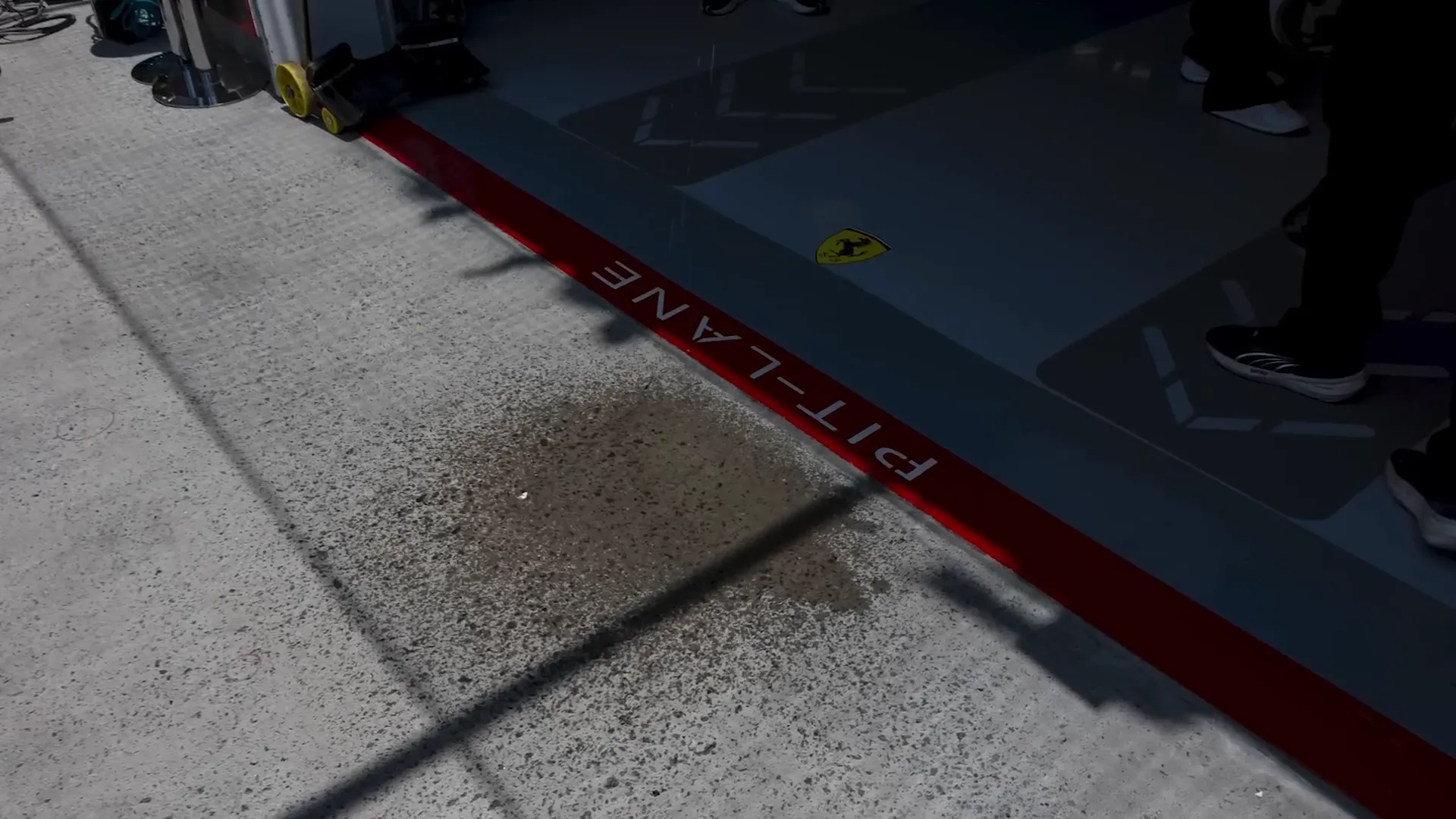 Water spill in front of Ferrari pit box