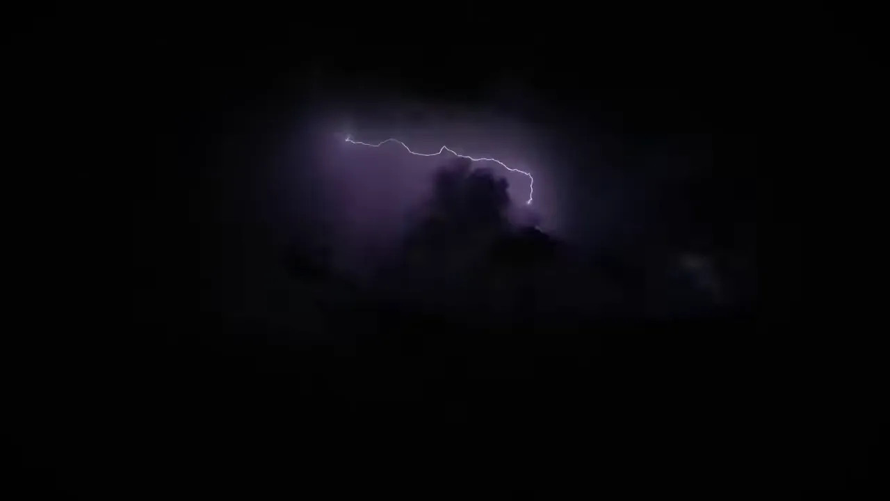 Lightning bolt flashing above clouds at night near the Las Vegas Grand Prix