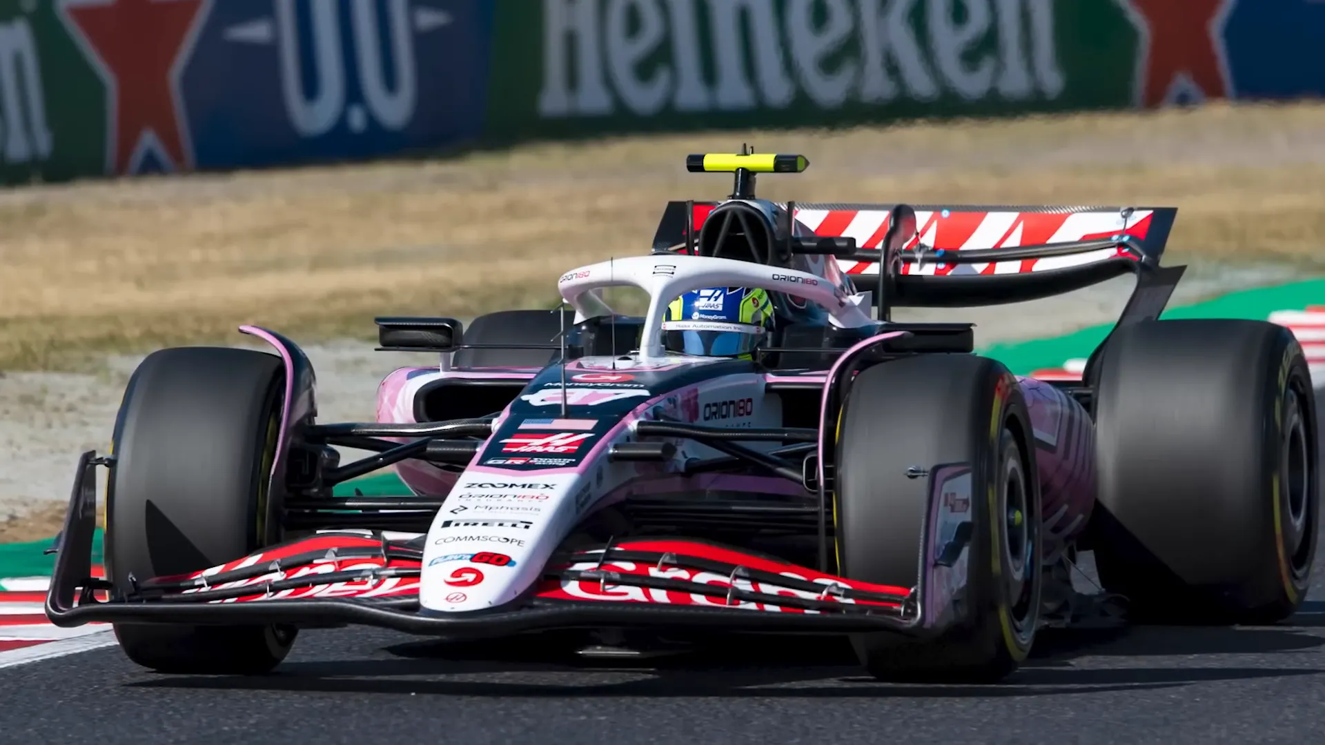 Haas cars featuring Japanese font and cherry blossoms