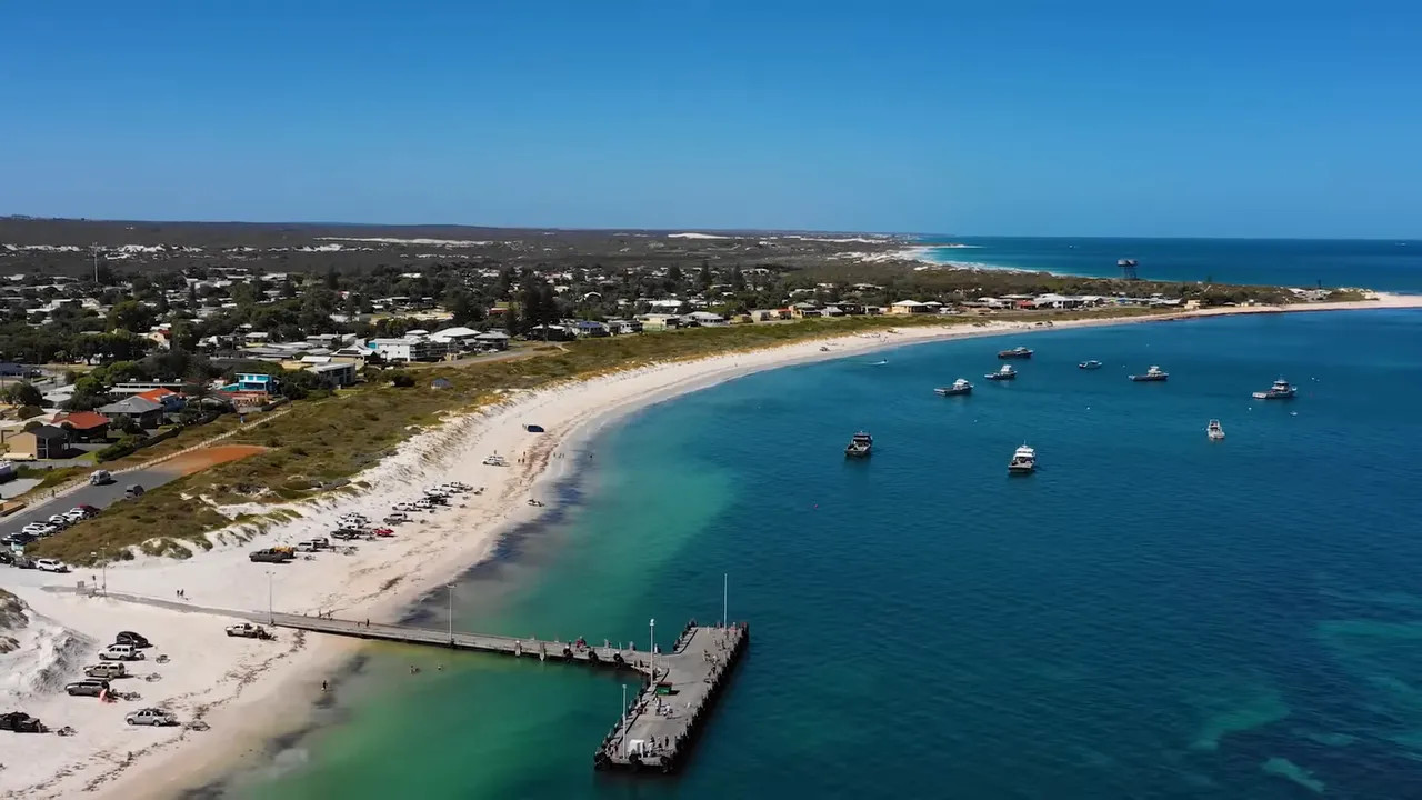 Aerial view of Lancelin coastline with turquoise water and moored boats