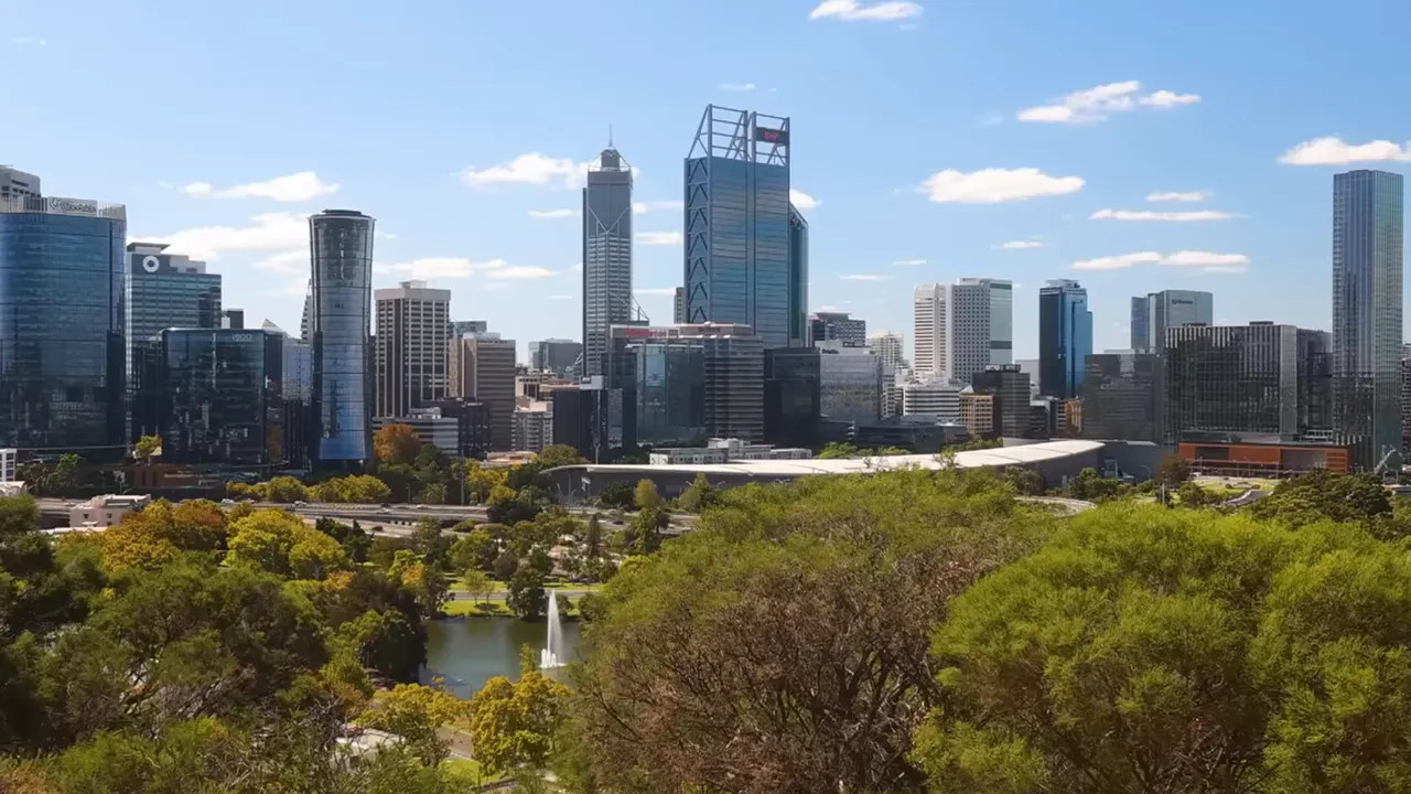 Aerial view of Perth skyline with modern office towers and greenery
