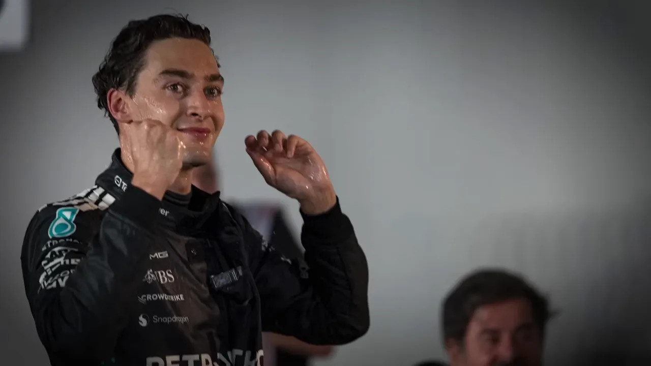George Russell celebrating his race win, spraying champagne