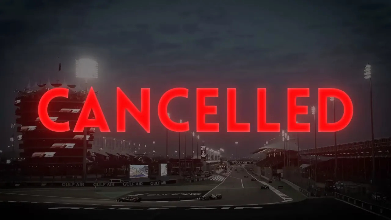 Night-time Formula 1 circuit with large red CANCELLED text overlay