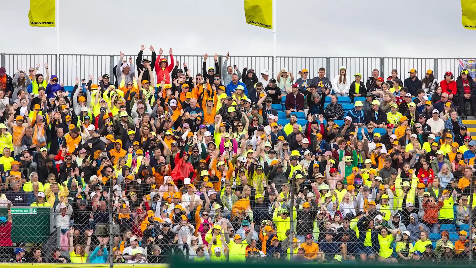 Lando Norris celebrating victory with fans in the Lando stand