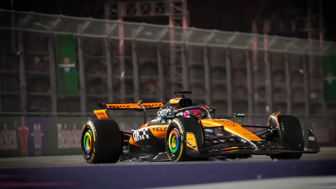 Low-angle close-up of an orange McLaren F1 car on the Las Vegas street circuit showing the underbody, wheels and very low ride height