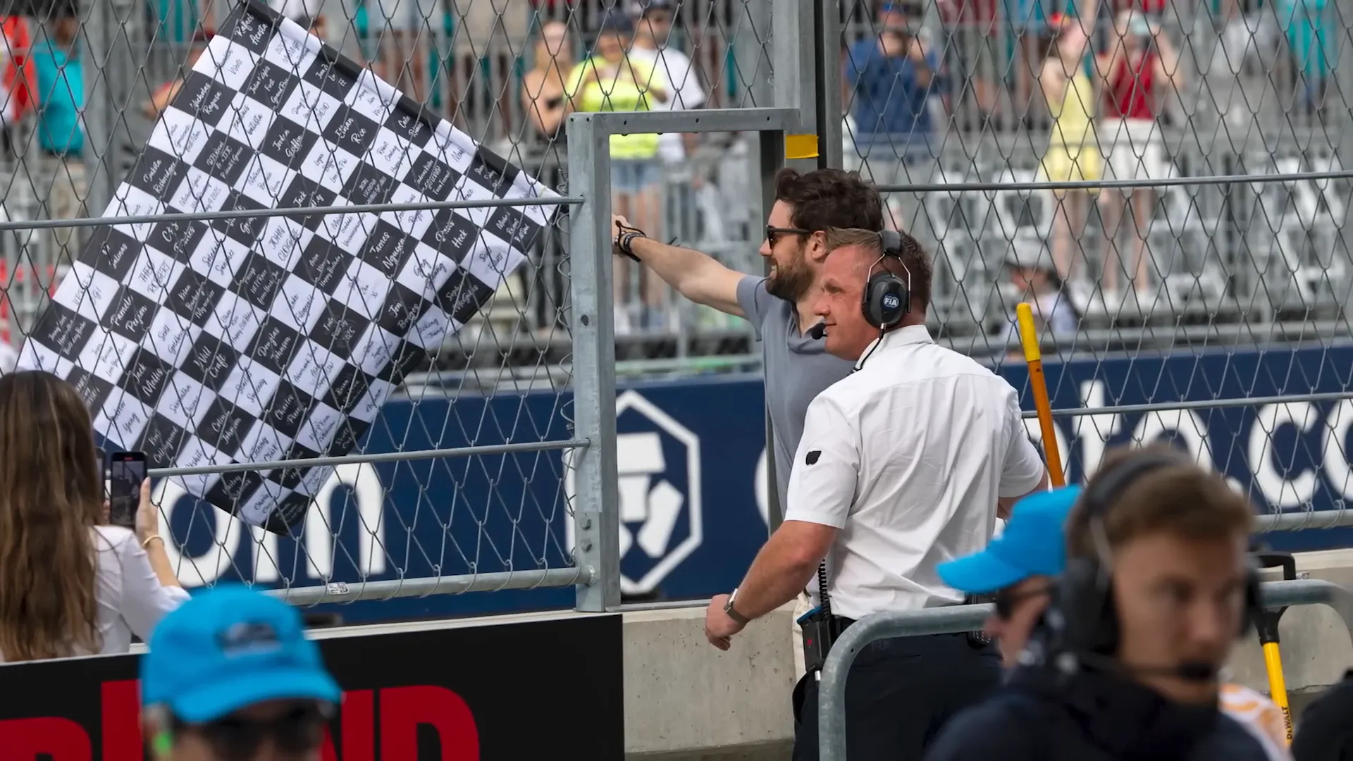 Jack Whitehall waving the checkered flag