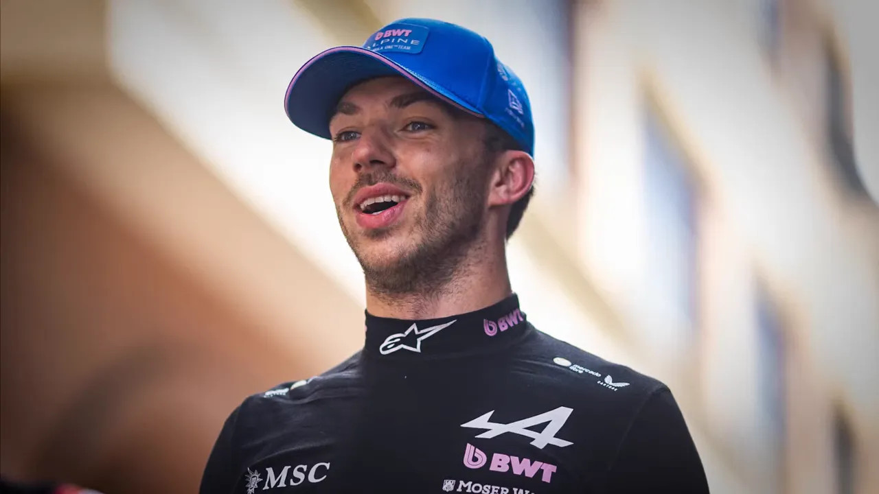 Pierre Gasly in Alpine team gear smiling outdoors