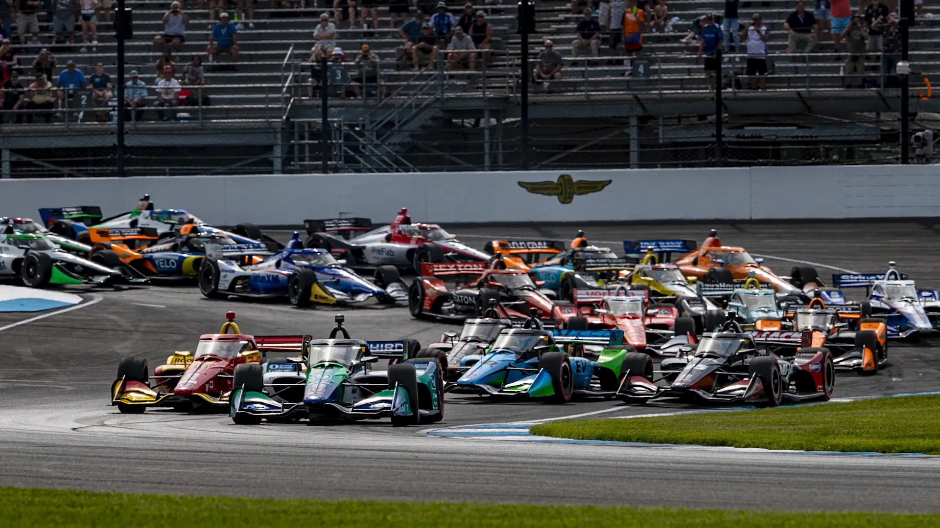 IndyCar race with multiple cars on track