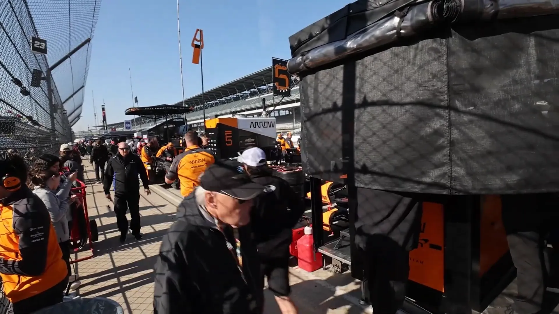 Photographers capturing action in the IndyCar pit lane