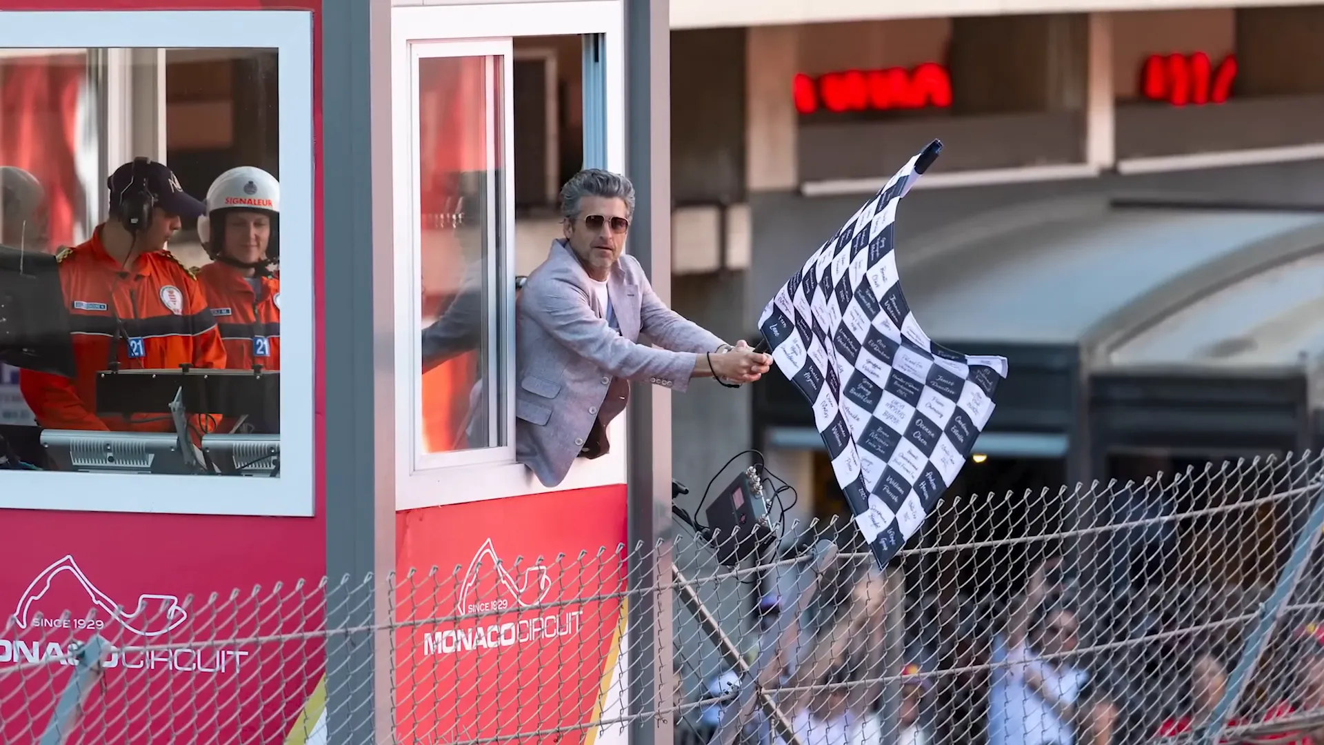 Patrick Dempsey waving the flag at Monaco