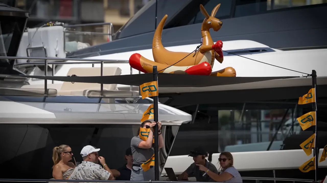 Inflatable kangaroo mounted on the upper deck of a yacht in Monaco harbour