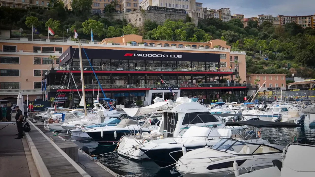 Multi level paddock club building beside the Monaco harbour and track fencing