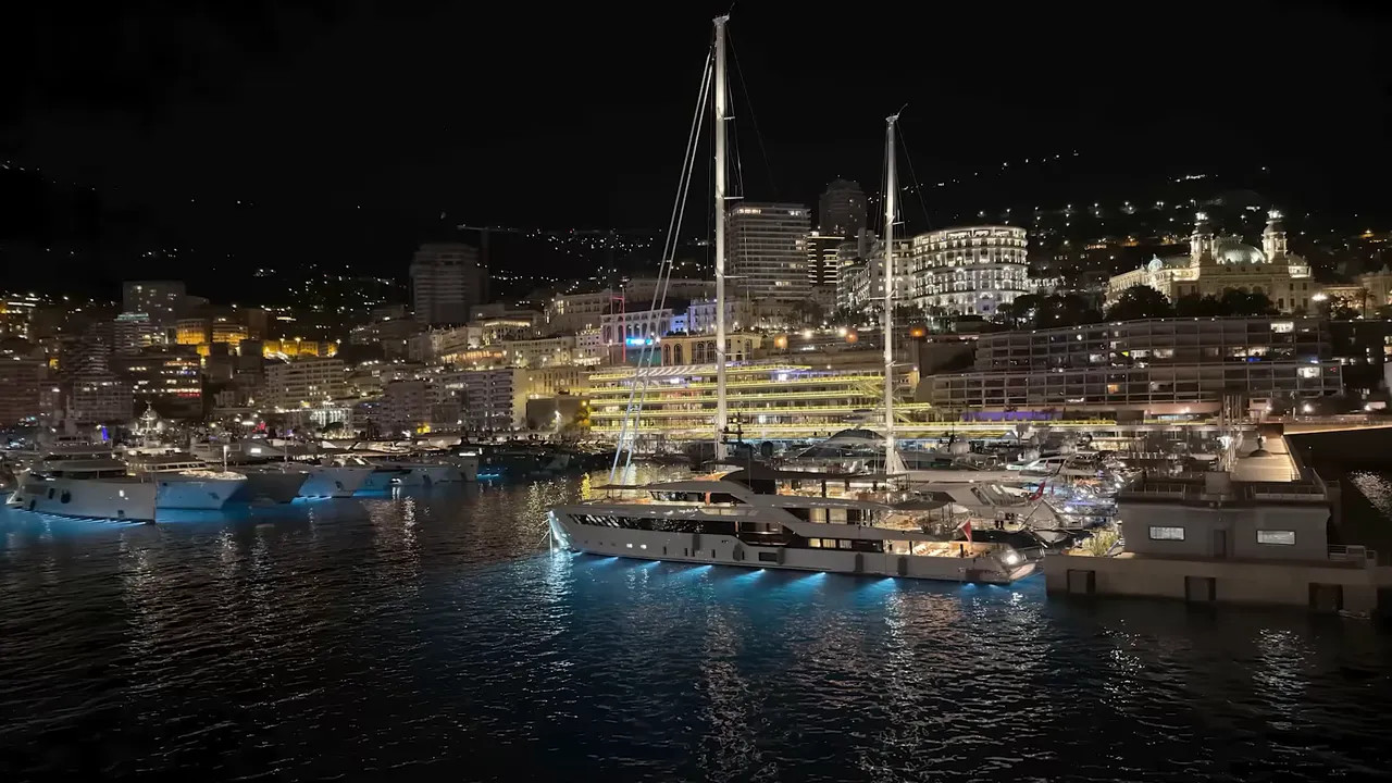 View from a ship balcony across Monaco harbour filled with yachts
