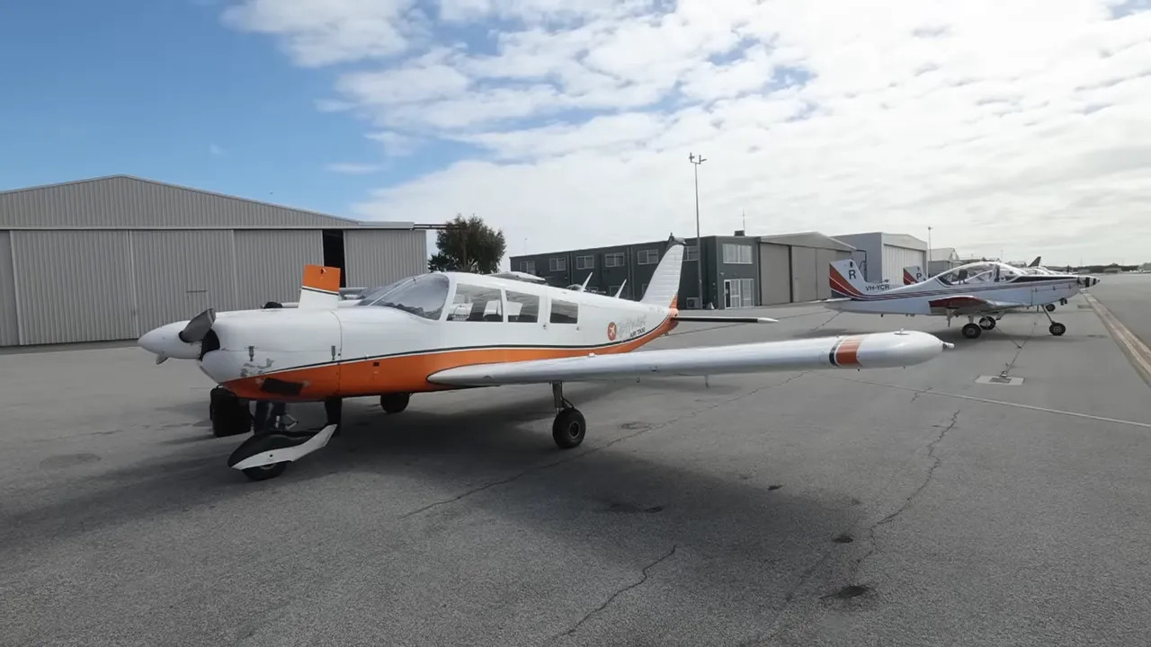 Small airplane parked on the tarmac for Rottnest Island flights