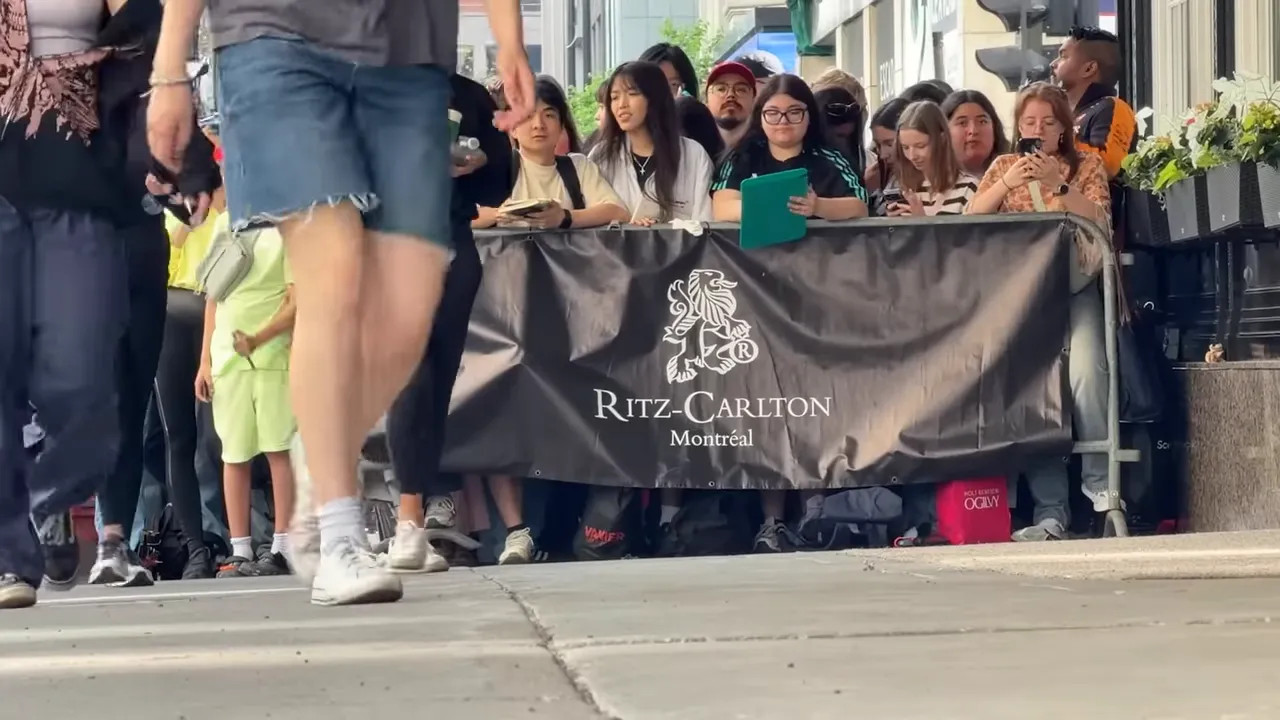 Fans gathered outside the Ritz-Carlton Montréal hotel with a Ritz banner