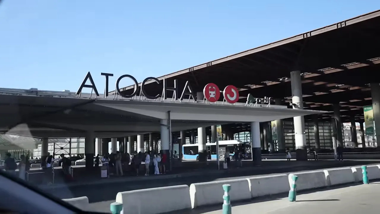 Atocha station entrance sign seen from a car