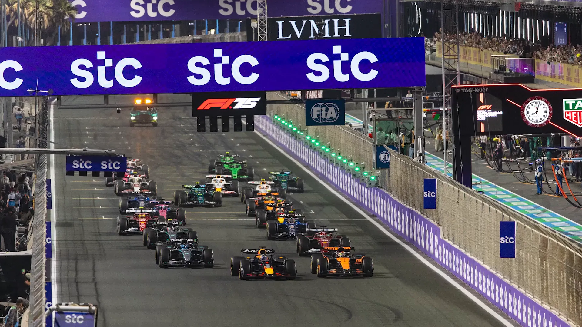 Oscar Piastri leading at turn one