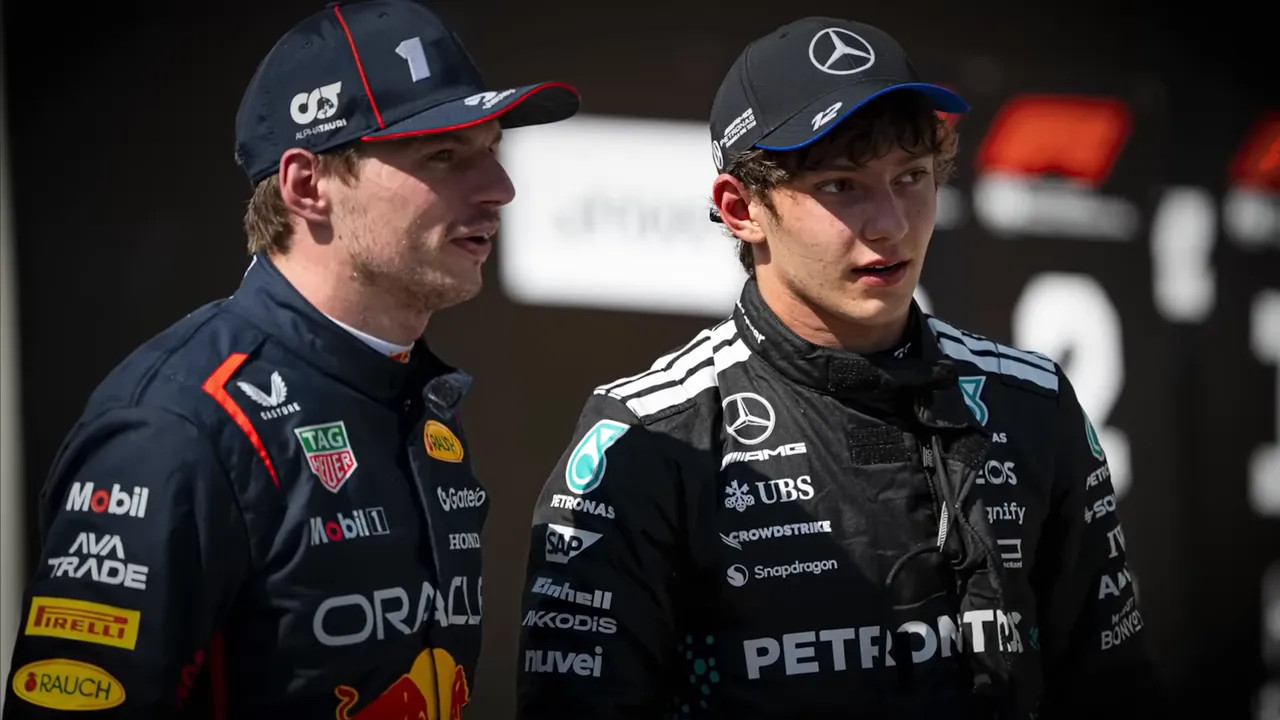 Max Verstappen pictured with his team personnel in a Formula 1 paddock setting