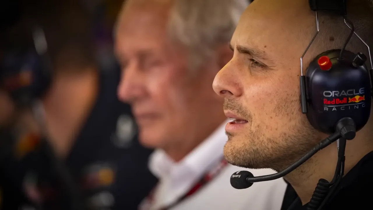 Race engineer wearing an Oracle Red Bull Racing headset in conversation