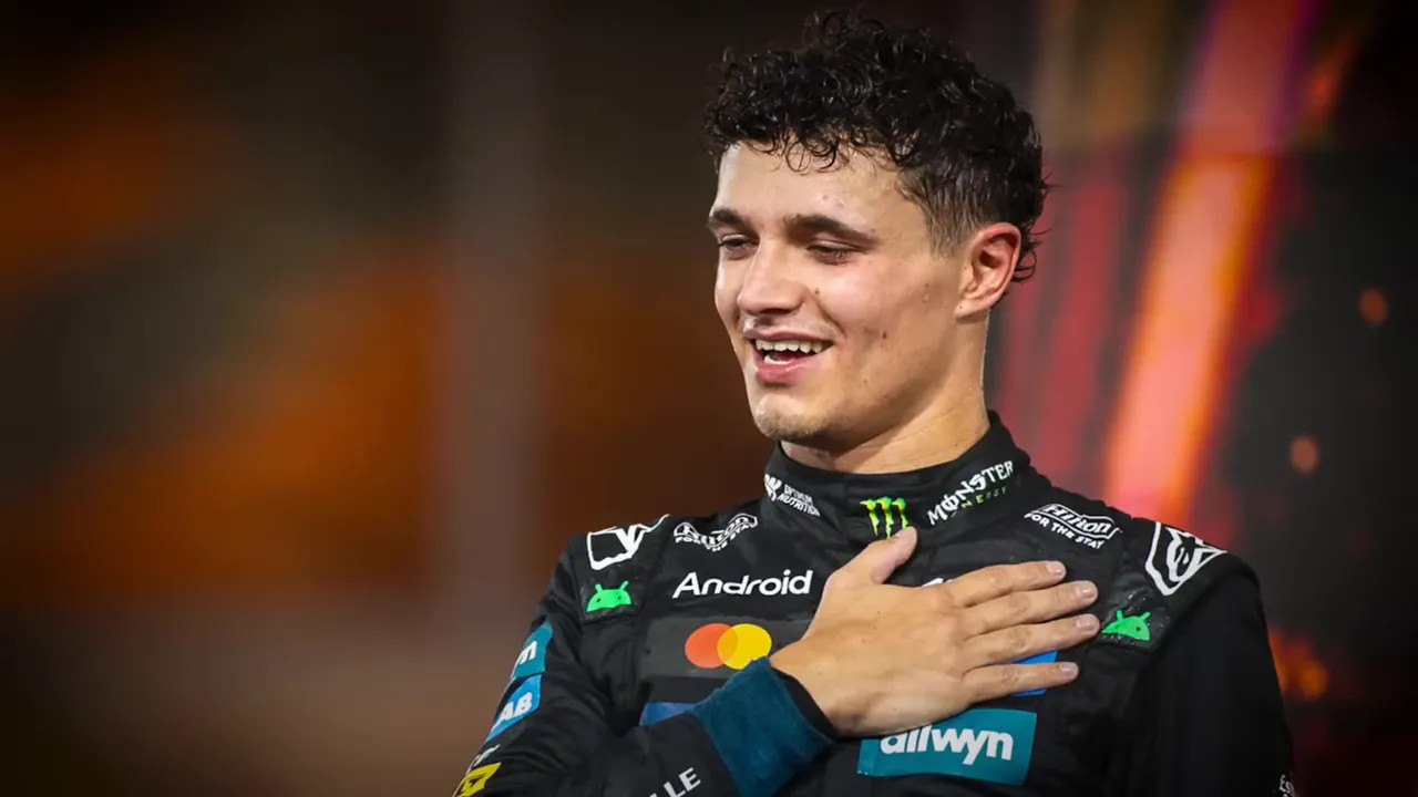 Driver with one hand on his chest, visibly emotional after the championship celebration