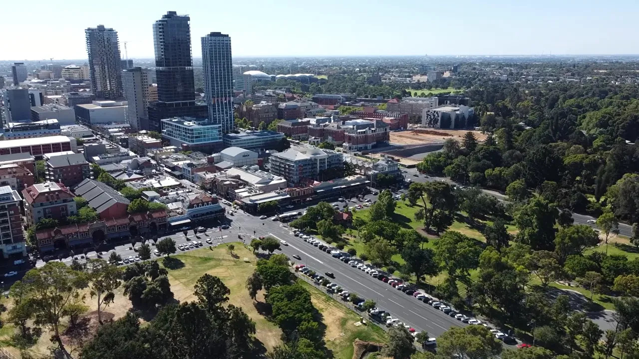 Aerial view of Adelaide city streets and parklands, showing a race-route corridor