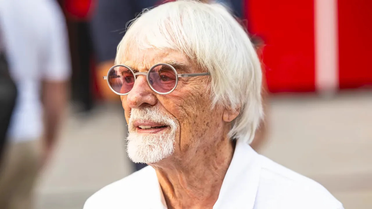 Portrait of an older man with white hair and glasses