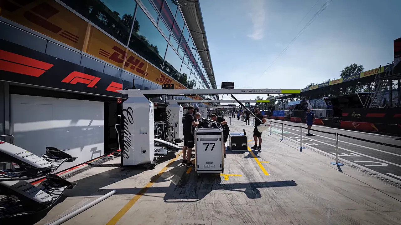 Pit lane ground marking labelled Front Axle beside a white line