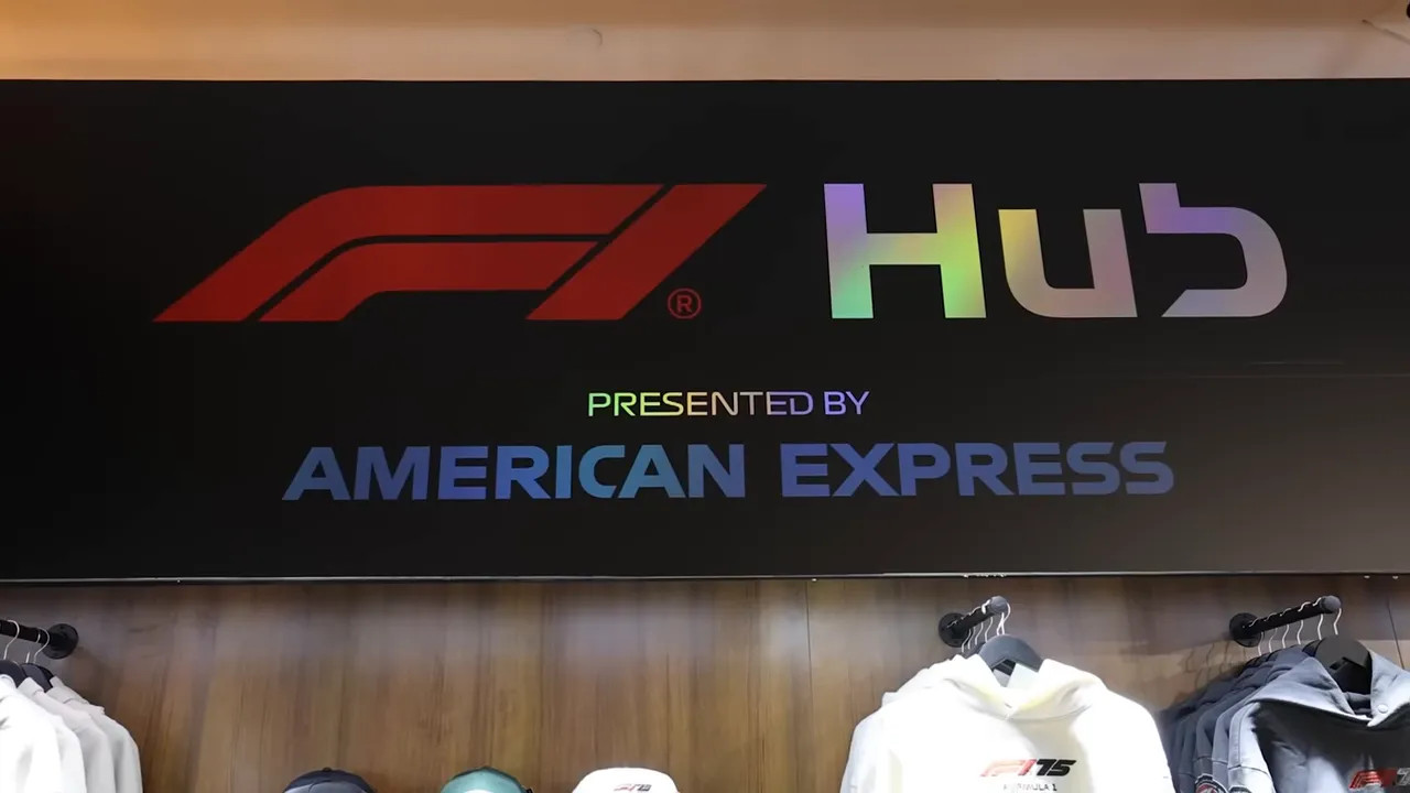 F1 Hub 'Presented by American Express' sign above a merchandise display at the F1 Hub inside the Venetian.