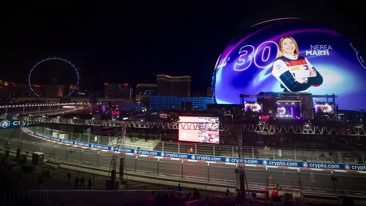 Night aerial view of the Las Vegas circuit with grandstands and the illuminated Sphere