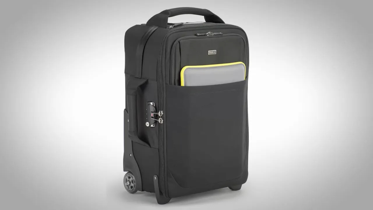 Black rolling carry-on camera bag on a studio background