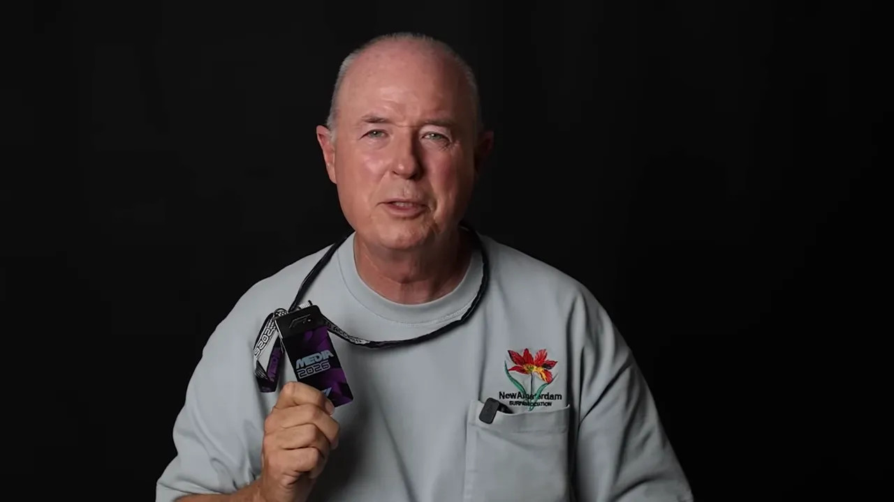 Media pass holder on camera holding a motorsport media credential
