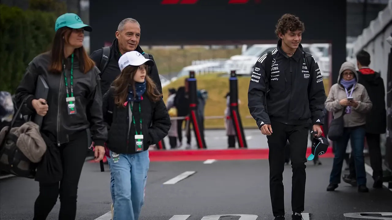 Antonelli walking through the paddock with his family