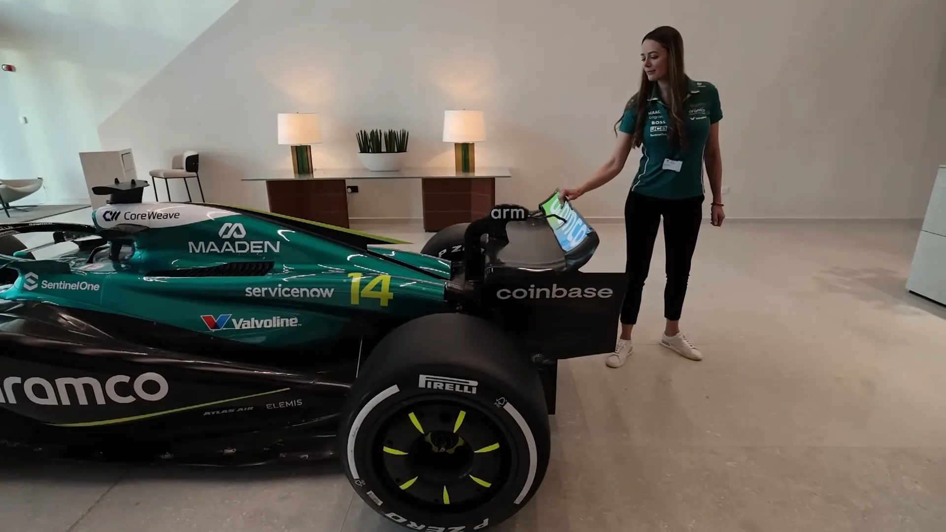 Aston Martin F1 team foyer with trophies and car