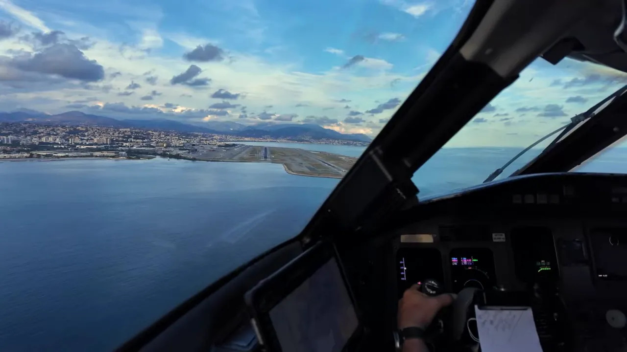 Cockpit view of a helicopter flying over the coast near Nice
