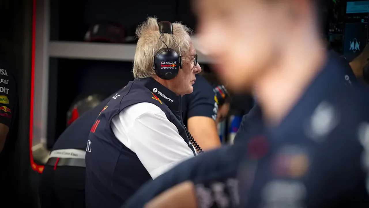 Red Bull garage with team members discussing strategy