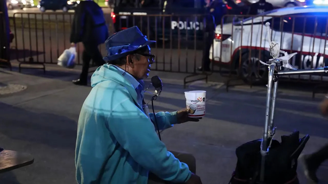 Fans singing and cheering a driver song in the stands