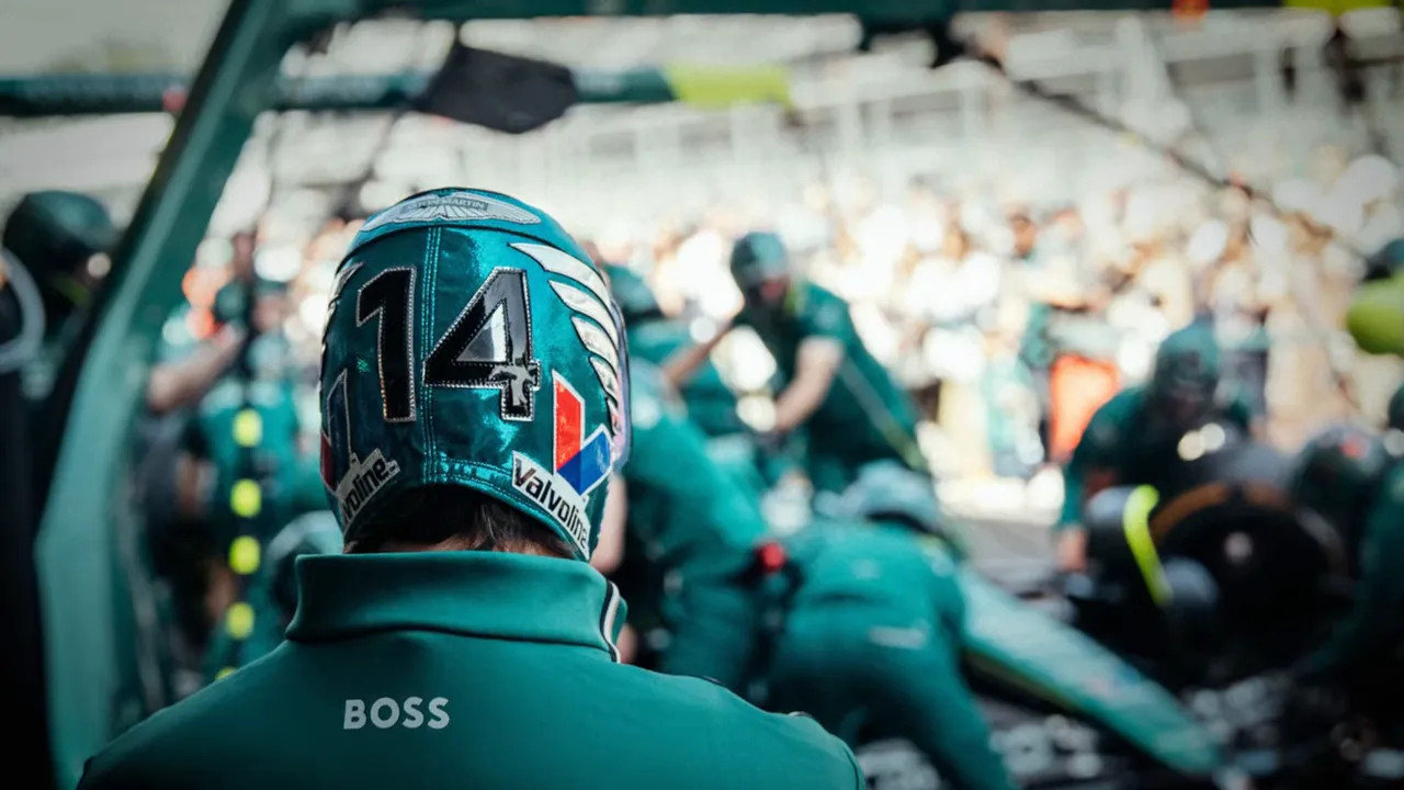 Fernando Alonso wearing a wrestling mask in the pit lane