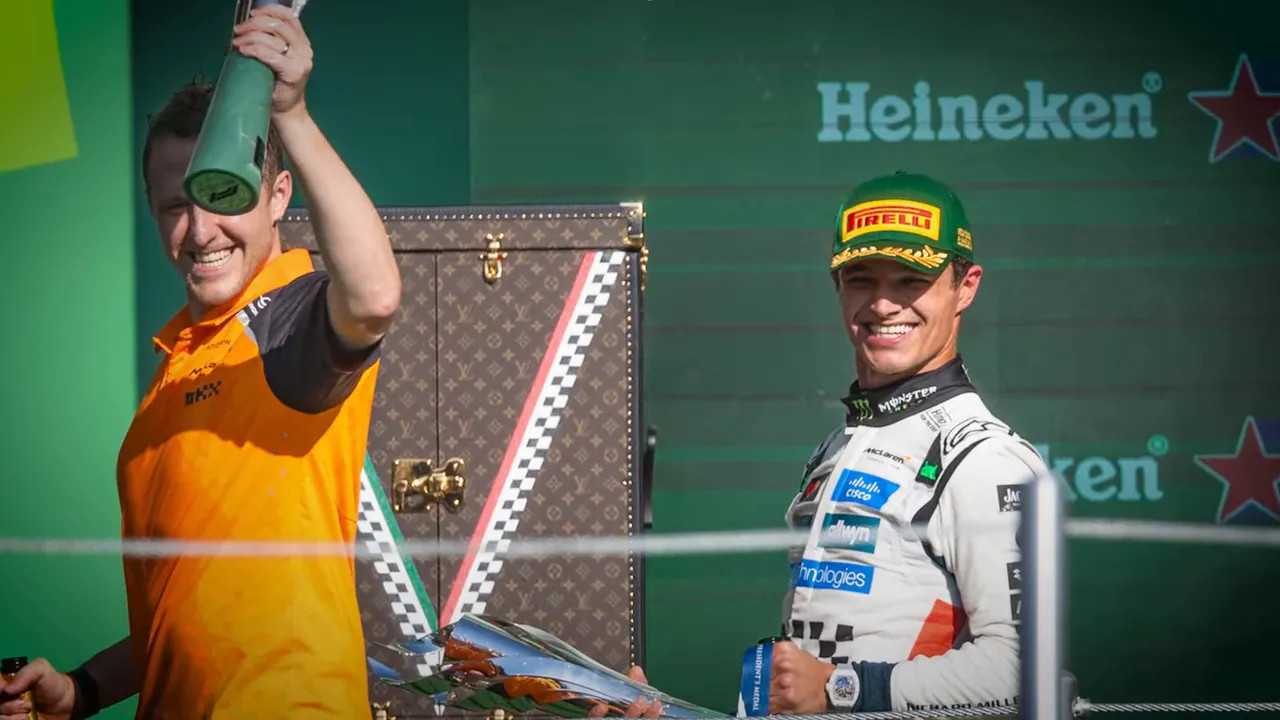 Lando Norris leaving the podium smiling despite boos