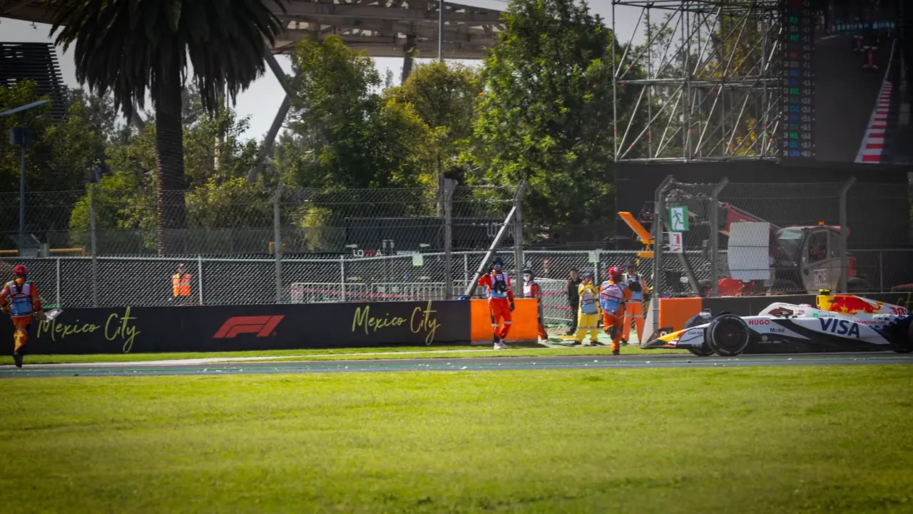 Marshal on track with a car approaching during lap three incident