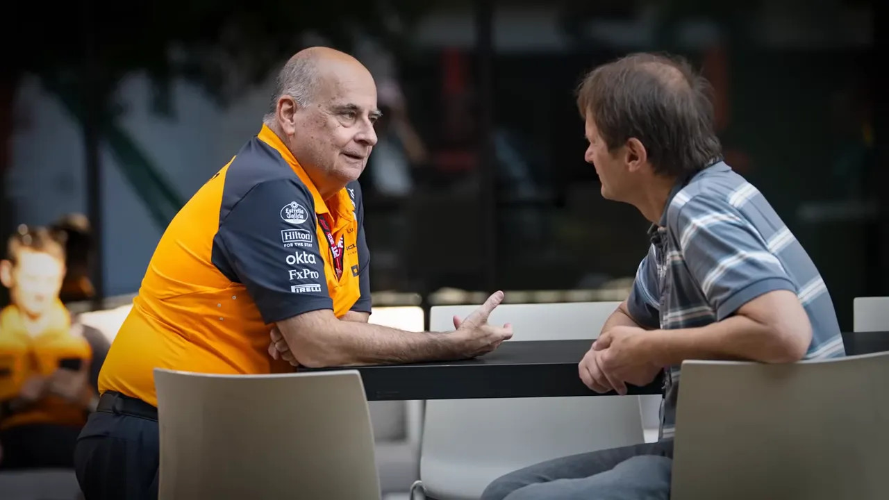 Ferrari personnel seated and talking in a private setting