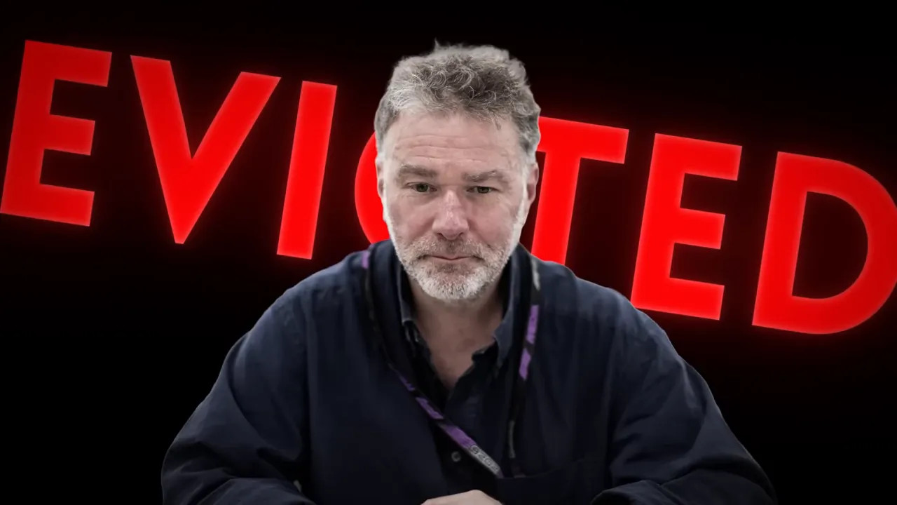 Giles Richards speaking on camera with an event backdrop