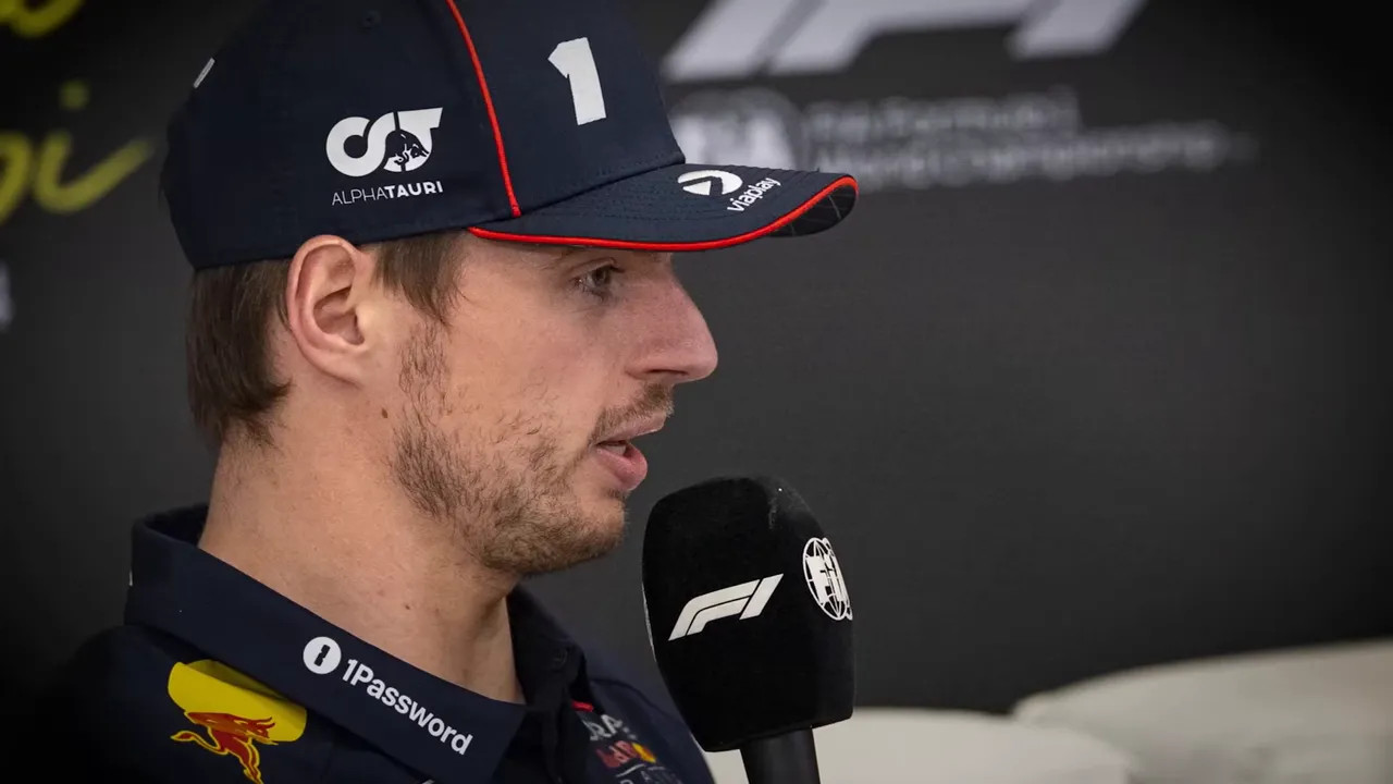 Max Verstappen in close-up speaking into a microphone wearing a race cap