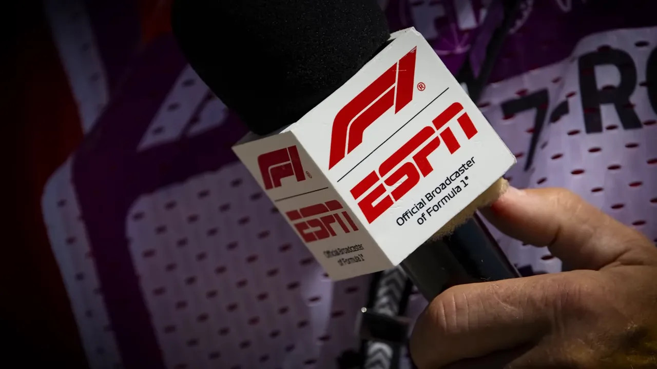 Close-up of an ESPN microphone flag and handheld mic showing F1 branding, high clarity