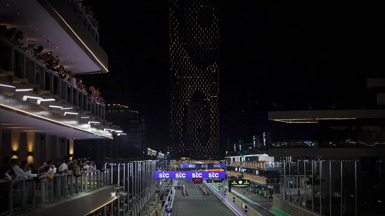 Miami Grand Prix circuit at night with grandstands and track lights